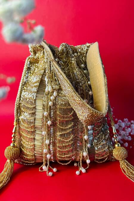 Shop_Nayaab By Sonia_Gold Cut Work, Pearls Briller Sac Twin Embellished Potli_Online_at_Aza_Fashions