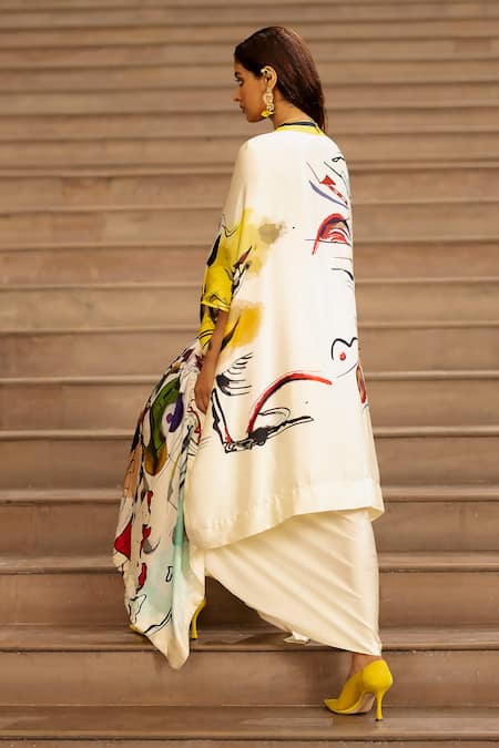 Shop AK-OK Cream Silk Drawstring Graphic Print Cape And Skirt Set at Aza Fashions Shop_AK-OK_Cream Silk Drawstring Graphic Print Cape And Skirt Set _at_Aza_Fashions