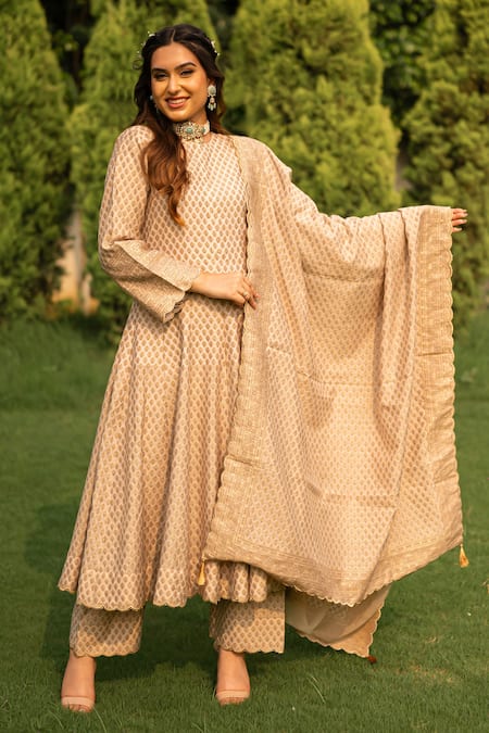 Safaa_Ivory Velour, Velvet Cut Work, Tassels, Zari Azara Floral Woven Anarkali Set _Online_at_Aza_Fashions