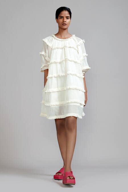 Buy MATI_1 Off White Cotton Round Neck Tiered Fringe Dress Online at Aza Fashions Buy_MATI_1_Off White Cotton Round Neck Tiered Fringe Dress _Online_at_Aza_Fashions