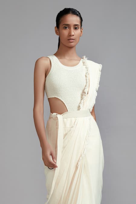 MATI_1 Off White Cotton Round Neck Frill Border Saree With Smocked Bodysuit Online at Aza Fashions MATI_1_Off White Cotton Round Neck Frill Border Saree With Smocked Bodysuit _Online_at_Aza_Fashions