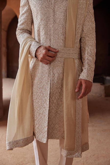 Shop Nitika Gujral Beige Silk, Cotton, Mohair Resham And Thread Embroidered Sherwani Trouser Set Online at Aza Fashions Shop_Nitika Gujral_Beige Silk, Cotton, Mohair Resham And Thread Embroidered Sherwani Trouser Set _Online_at_Aza_Fashions