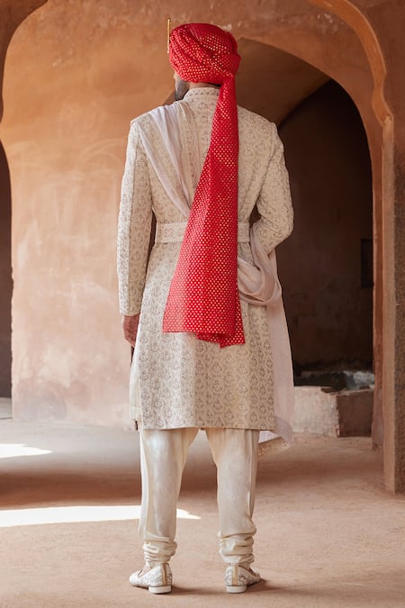 Shop Nitika Gujral Beige Tussar, Silk, Cotton Embroidery Raw Resham Sherwani Churidar Set at Aza Fashions Shop_Nitika Gujral_Beige Tussar, Silk, Cotton Embroidery Raw Resham Sherwani Churidar Set _at_Aza_Fashions