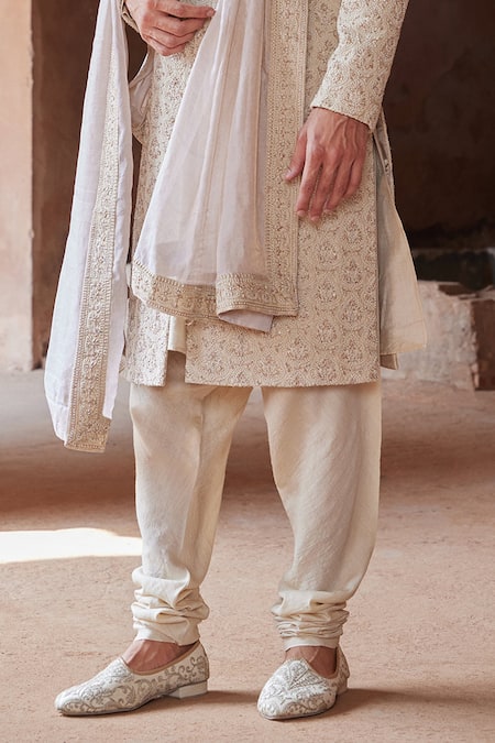 Shop Nitika Gujral Beige Tussar, Silk, Cotton Embroidery Raw Resham Sherwani Churidar Set Online at Aza Fashions Shop_Nitika Gujral_Beige Tussar, Silk, Cotton Embroidery Raw Resham Sherwani Churidar Set _Online_at_Aza_Fashions