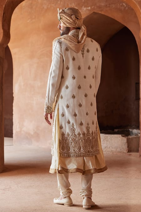 Shop Nitika Gujral Ivory Matka Silk Embroidered Zardozi Sherwani And Kurta Set at Aza Fashions Shop_Nitika Gujral_Ivory Matka Silk Embroidered Zardozi Sherwani And Kurta Set _at_Aza_Fashions