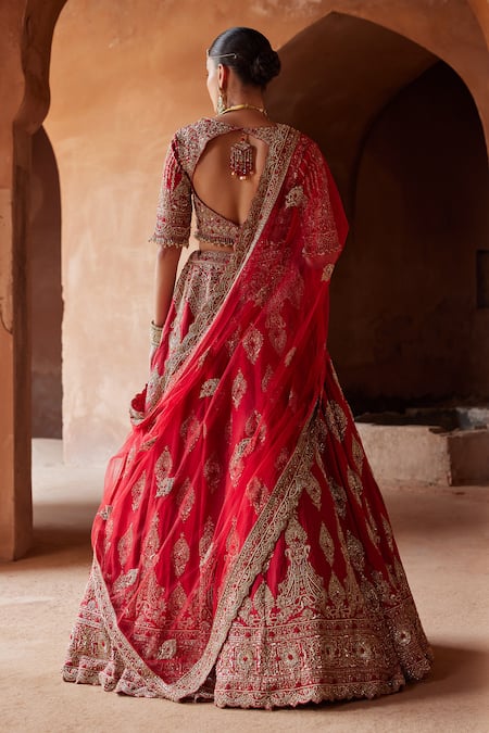 Shop_Nitika Gujral_Red Silk, Net Crystals, Sequins, Beads, Raw Embroidered Bridal Lehenga Set _at_Aza_Fashions