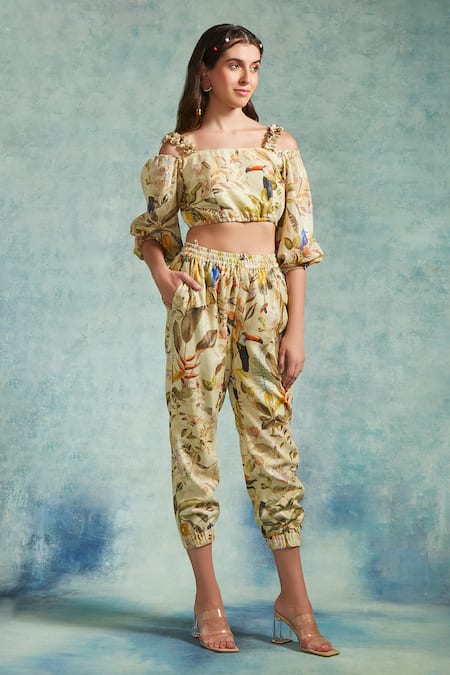 Radhika & Raghav_Yellow Cotton Pearls Open Neck Floral Print Crop Top Jogger Set_at_Aza_Fashions