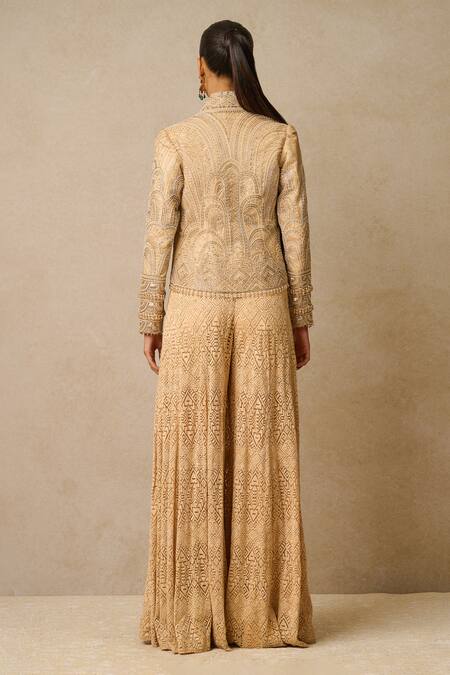 Shop Tarun Tahiliani Beige Tulle Sequins Shawl Neck Jumpsuit With Embellished Gilet at Aza Fashions Shop_Tarun Tahiliani_Beige Tulle Sequins Shawl Neck Jumpsuit With Embellished Gilet_at_Aza_Fashions