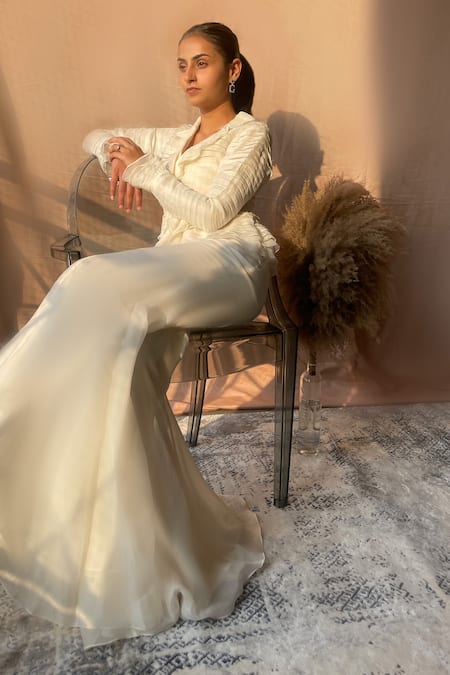 Shop Aakansha Gupta Ivory Organza, Satin V-neck Noa Ruffle Layered Top And Flared Pant Set at Aza Fashions Shop_Aakansha Gupta_Ivory Organza, Satin V-neck Noa Ruffle Layered Top And Flared Pant Set _at_Aza_Fashions