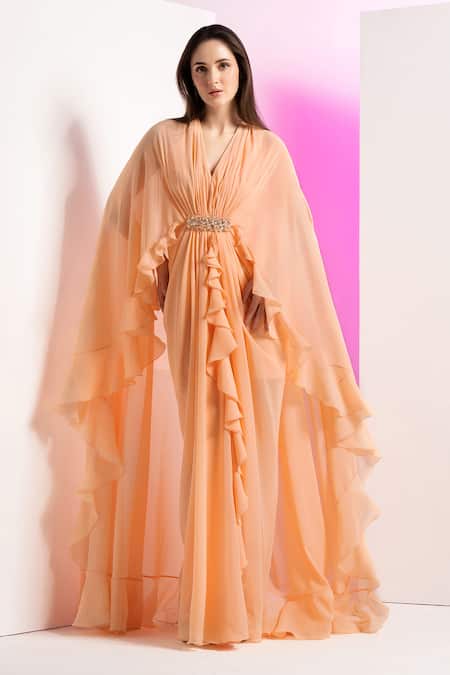 Buy Mandira Wirk Resort Peach Georgette Sequins, Beads, Stones V-neck Pleated Draped Cape Sleeve Dress Online at Aza Fashions Buy_Mandira Wirk Resort_Peach Georgette Sequins, Beads, Stones V-neck Pleated Draped Cape Sleeve Dress _Online_at_Aza_Fashions