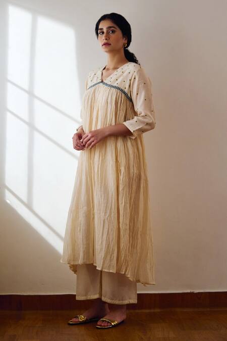 Dot Ivory Cotton Embroidery V-neck Nyla Yoke Kurta And Pant Set at Aza Fashions Dot_Ivory Cotton Embroidery V-neck Nyla Yoke Kurta And Pant Set _at_Aza_Fashions