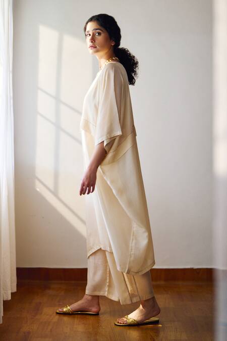 Buy Dot Ivory Cotton, Silk Round Neck Oleria Solid Kurta And Pant Set Online at Aza Fashions Buy_Dot_Ivory Cotton, Silk Round Neck Oleria Solid Kurta And Pant Set _Online_at_Aza_Fashions