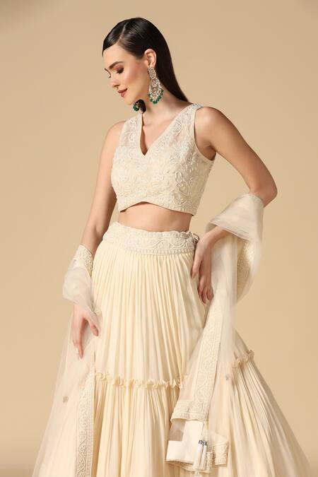 Two Sisters By Gyans_White Net, Georgette Pearls V-neck Pleated Lehenga Set With Embroidered Blouse _at_Aza_Fashions
