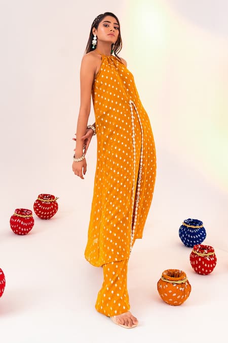Silky Bindra_Yellow Georgette Crystals Halter Neck Geometric Pattern Tunic With Pant _at_Aza_Fashions