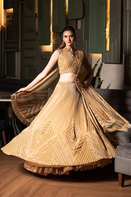 Midushi Bajoria_Gold Georgette, Tulle Cut Work, Sequins Geometric Embroidered Lehenga Set _at_Aza_Fashions