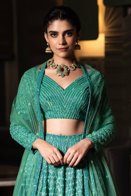 Shop Midushi Bajoria Green Georgette, Tulle Sequins, Cut Work V-neck Jaal Embellished Lehenga Set Online at Aza Fashions Shop_Midushi Bajoria_Green Georgette, Tulle Sequins, Cut Work V-neck Jaal Embellished Lehenga Set _Online_at_Aza_Fashions