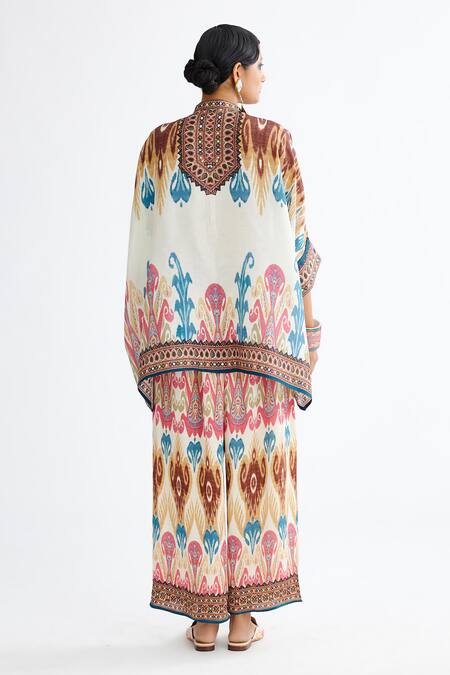 Shop Rajdeep Ranawat Multi Color Silk Bandeau Neck Chanel Printed Tunic And Flared Pant Set at Aza Fashions Shop_Rajdeep Ranawat_Multi Color Silk Bandeau Neck Chanel Printed Tunic And Flared Pant Set_at_Aza_Fashions