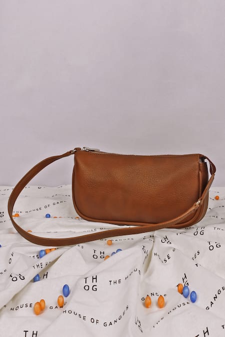 Buy Brown Textured Pattern Daily Plain Curved Shape Sling Bag by The House  of Ganges Online at Aza Fashions.