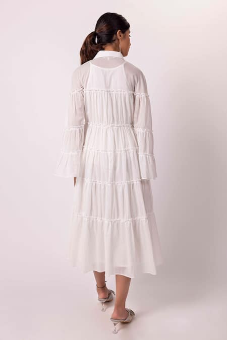 Shop Shimona Off White Cotton Shawl Neck Solid Tiered Dress at Aza Fashions Shop_Shimona_Off White Cotton Shawl Neck Solid Tiered Dress _at_Aza_Fashions