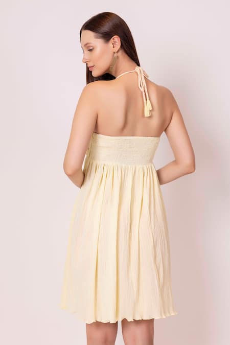 Shop Shimona Yellow Cotton Embroidery Halter Neck Iris Floral Cutwrok Dress at Aza Fashions Shop_Shimona_Yellow Cotton Embroidery Halter Neck Iris Floral Cutwrok Dress _at_Aza_Fashions