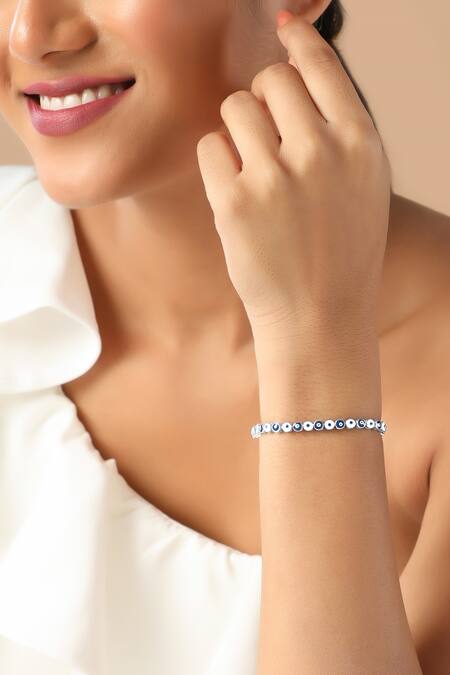 Buy Curio Cottage Silver Plated Crystals Tranquil Eyelet Enamelled Bracelet at Aza Fashions Buy_Curio Cottage_Silver Plated Crystals Tranquil Eyelet Enamelled Bracelet_at_Aza_Fashions