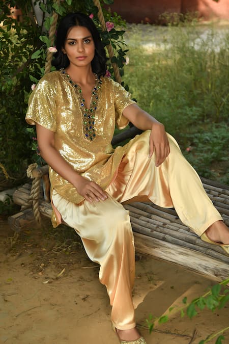 Shop NUHH Gold Satin Sequins Split V-neck Embellished Kurta With Salwar at Aza Fashions Shop_NUHH_Gold Satin Sequins Split V-neck Embellished Kurta With Salwar _at_Aza_Fashions