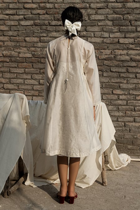 Shop Ahmev Ivory Chanderi Embroidery Round Neck Snowdrop Smocked Bodice Dress With Slip at Aza Fashions Shop_Ahmev_Ivory Chanderi Embroidery Round Neck Snowdrop Smocked Bodice Dress With Slip _at_Aza_Fashions
