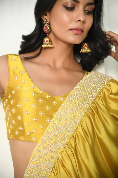 Buy NUHH Yellow Satin Pearls Round Neck Mermaid Pre Draped Ruffle Saree With Blouse Online at Aza Fashions Buy_NUHH_Yellow Satin Pearls Round Neck Mermaid Pre Draped Ruffle Saree With Blouse _Online_at_Aza_Fashions