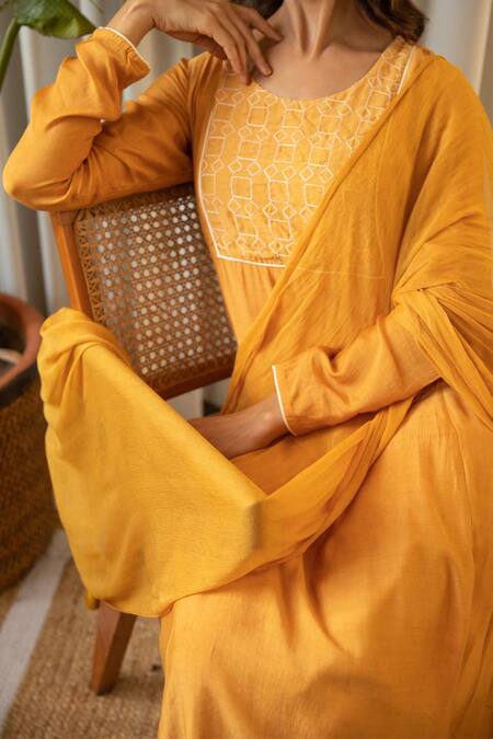 Shop_Kapraaaha_Yellow Muslin Tassels Round Neck Geometric Embroidered Yoke Kurta Set_Online_at_Aza_Fashions