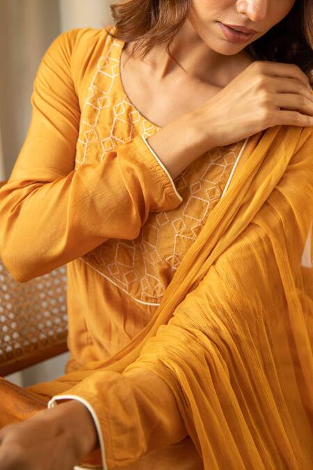 Kapraaaha_Yellow Muslin Tassels Round Neck Geometric Embroidered Yoke Kurta Set_at_Aza_Fashions