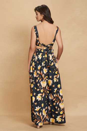 Shop Gulabo By Abu Sandeep Black Cotton Satin Lotus Bloom Print Flared Pant at Aza Fashions Shop_Gulabo By Abu Sandeep_Black Cotton Satin Lotus Bloom Print Flared Pant _at_Aza_Fashions