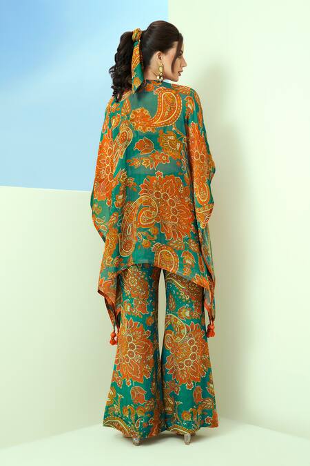 Shop Taavare Blue Organza Sequins V-neck Floral And Paisley Print Kaftan Bell-bottom Pant Set at Aza Fashions Shop_Taavare_Blue Organza Sequins V-neck Floral And Paisley Print Kaftan Bell-bottom Pant Set_at_Aza_Fashions