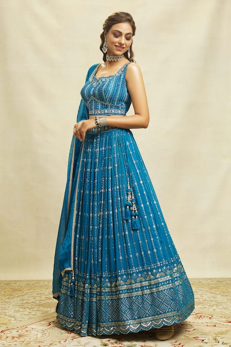 Buy Ariyana By Aza Blue Silk, Net, Georgette Embroidery, Sequins Asymmetric Scalloped Lehenga Set Buy_Ariyana By Aza_Blue Silk, Net, Georgette Embroidery, Sequins Asymmetric Scalloped Lehenga Set