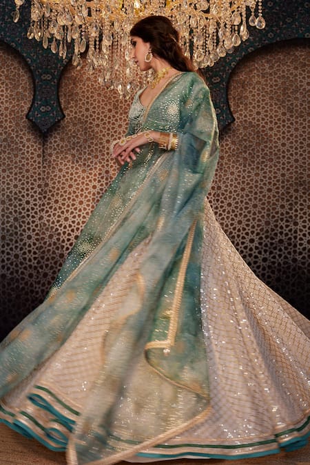 Shop Cedar & Pine Ivory Organza Sequins, Embroidery V-neck Jaali Lehenga Set Online at Aza Fashions Shop_Cedar & Pine_Ivory Organza Sequins, Embroidery V-neck Jaali Lehenga Set _Online_at_Aza_Fashions