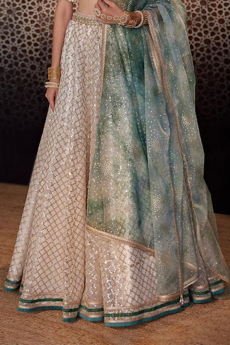 Cedar & Pine Ivory Organza Sequins, Embroidery V-neck Jaali Lehenga Set at Aza Fashions Cedar & Pine_Ivory Organza Sequins, Embroidery V-neck Jaali Lehenga Set _at_Aza_Fashions