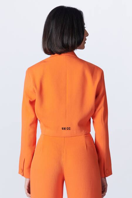 S&N By Shantnu Nikhil Orange Crepe Collared Notched Lapel Crop Jacket at Aza Fashions S&N By Shantnu Nikhil_Orange Crepe Collared Notched Lapel Crop Jacket_at_Aza_Fashions