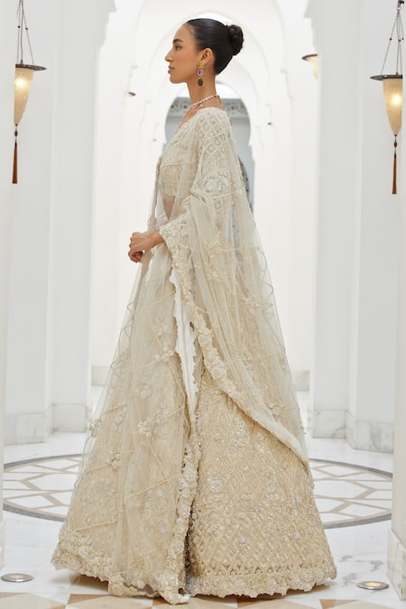Buy_Nitika Gujral_Ivory Satin, Net Sequins, Crystals, Lily Bloom Embroidered Bridal Lehenga Set _Online_at_Aza_Fashions