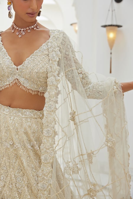 Shop_Nitika Gujral_Ivory Satin, Net Sequins, Crystals, Lily Bloom Embroidered Bridal Lehenga Set _Online_at_Aza_Fashions