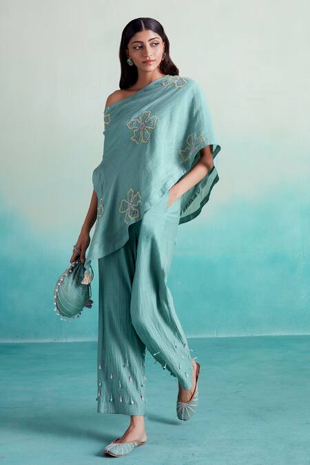 The Right Cut Blue Chanderi, Linen Embroidery Off-shoulder Mintella Floral Top And Trouser Set at Aza Fashions The Right Cut_Blue Chanderi, Linen Embroidery Off-shoulder Mintella Floral Top And Trouser Set _at_Aza_Fashions