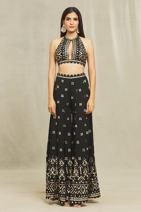 Gopi Vaid Black Georgette Sequins, Mirrors, Embroidery Halter Ishana Blouse And Sharara Set at Aza Fashions Gopi Vaid_Black Georgette Sequins, Mirrors, Embroidery Halter Ishana Blouse And Sharara Set _at_Aza_Fashions