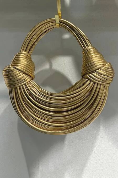 Shop Pine And Drew Gold Iris Semi Circle Shaped Leather Bag at Aza Fashions Shop_Pine And Drew_Gold Iris Semi Circle Shaped Leather Bag_at_Aza_Fashions