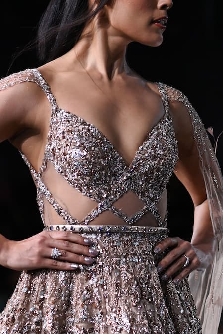 Dolly J Beige Tulle Sequins, Beads, Feathers Althea Embroidered Cape Sleeve Gown Online at Aza Fashions Dolly J_Beige Tulle Sequins, Beads, Feathers Althea Embroidered Cape Sleeve Gown _Online_at_Aza_Fashions