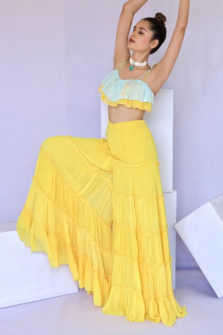 Shop Foram Patel Yellow Net, Georgette Embroidery Tiered Flared Pant With Printed Ruffle Blouse at Aza Fashions Shop_Foram Patel_Yellow Net, Georgette Embroidery Tiered Flared Pant With Printed Ruffle Blouse_at_Aza_Fashions