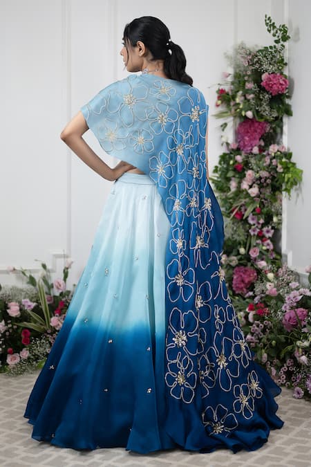 Shop Kiran Kalsi Blue Crepe, Organza Embroidery, Sequins V-neck Ombre Lehenga And Floral Cape Set at Aza Fashions Shop_Kiran Kalsi_Blue Crepe, Organza Embroidery, Sequins V-neck Ombre Lehenga And Floral Cape Set _at_Aza_Fashions