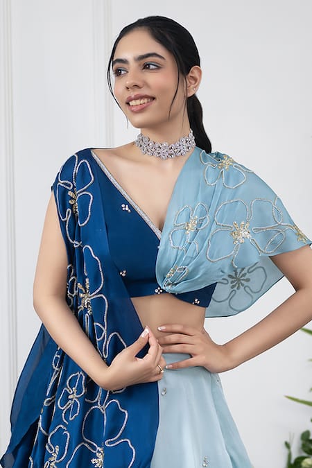 Kiran Kalsi Blue Crepe, Organza Embroidery, Sequins V-neck Ombre Lehenga And Floral Cape Set Online at Aza Fashions Kiran Kalsi_Blue Crepe, Organza Embroidery, Sequins V-neck Ombre Lehenga And Floral Cape Set _Online_at_Aza_Fashions