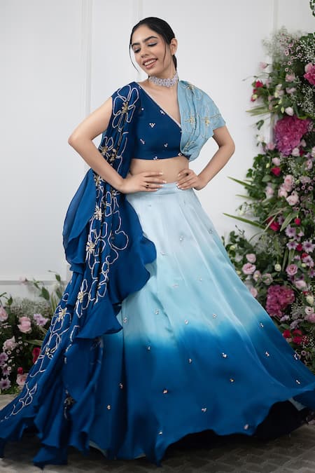 Shop Kiran Kalsi Blue Crepe, Organza Embroidery, Sequins V-neck Ombre Lehenga And Floral Cape Set Online at Aza Fashions Shop_Kiran Kalsi_Blue Crepe, Organza Embroidery, Sequins V-neck Ombre Lehenga And Floral Cape Set _Online_at_Aza_Fashions
