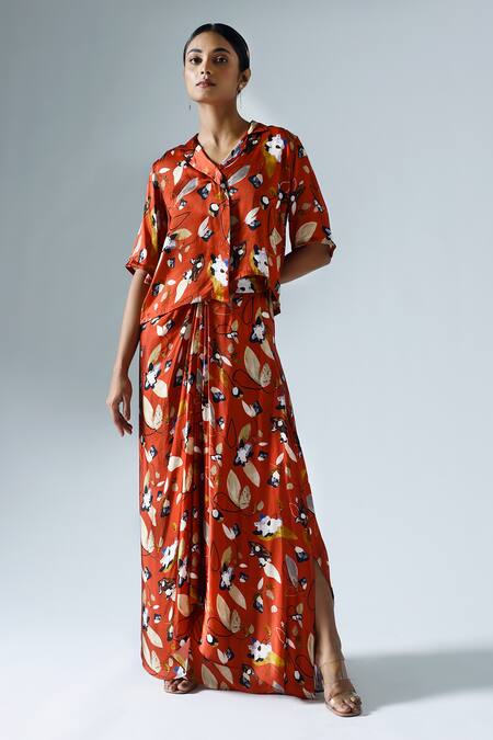Shop Klad Red Satin Printed Floral Lapel Collar Asymmetrical Top And Skirt Set at Aza Fashions Shop_Klad_Red Satin Printed Floral Lapel Collar Asymmetrical Top And Skirt Set_at_Aza_Fashions