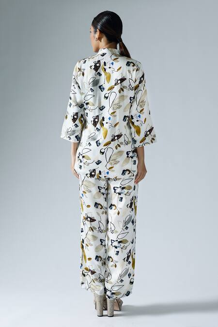Shop Klad White Satin Printed Abstract Floral Mandarin Shirt And Slit Pant Co-ord Set at Aza Fashions Shop_Klad_White Satin Printed Abstract Floral Mandarin Shirt And Slit Pant Co-ord Set_at_Aza_Fashions