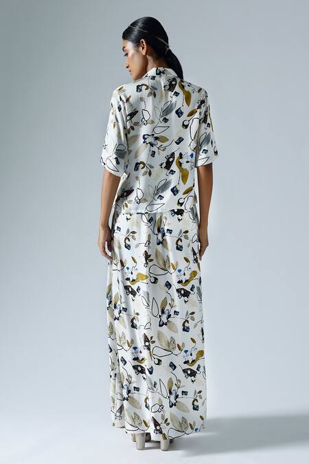 Shop Klad White Satin Printed Floral Lapel Collar Asymmetrical Top And Skirt Set at Aza Fashions Shop_Klad_White Satin Printed Floral Lapel Collar Asymmetrical Top And Skirt Set_at_Aza_Fashions
