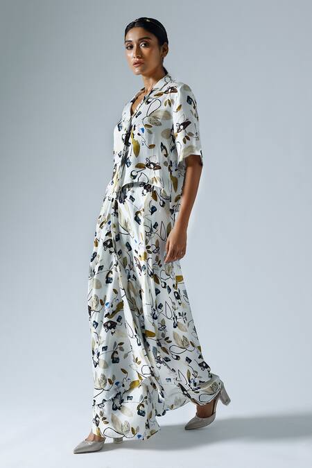 Buy Klad White Satin Printed Floral Lapel Collar Asymmetrical Top And Skirt Set Online at Aza Fashions Buy_Klad_White Satin Printed Floral Lapel Collar Asymmetrical Top And Skirt Set_Online_at_Aza_Fashions